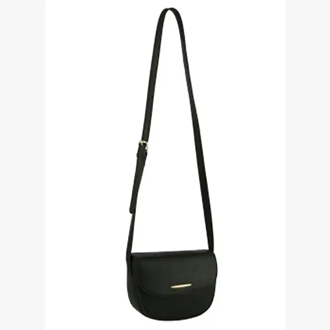 The Top Flap Petite Crossbody Bag is a small black faux leather bag with an adjustable single strap, flap closure, gold-toned hardware, and a gold rectangular accent on the front.
