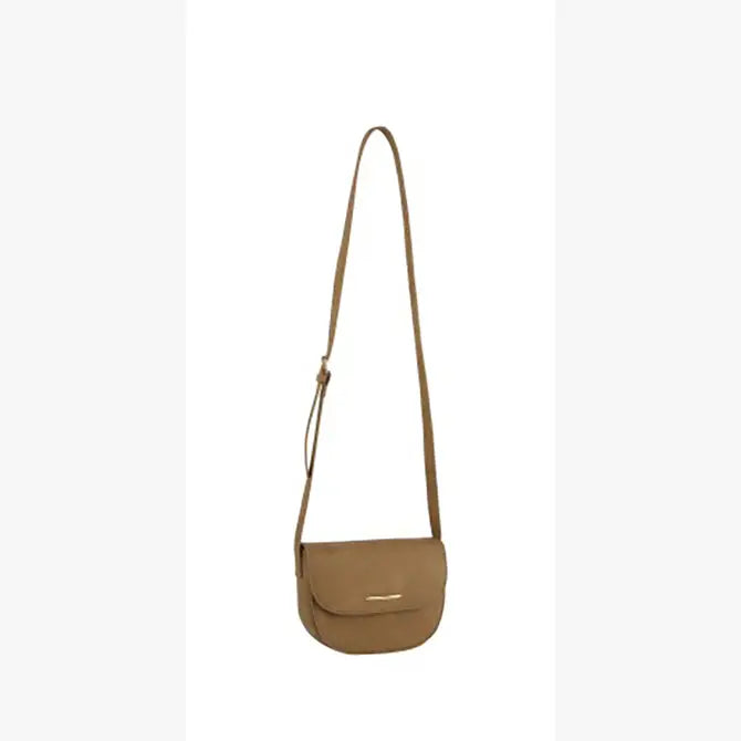 The Top Flap Petite Crossbody Bag is a small brown faux leather bag with a front flap closure, long adjustable strap, and gold-toned hardware, shown against a plain white background.