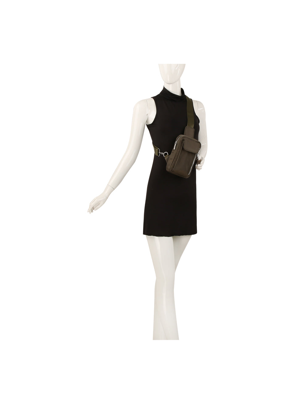 A mannequin wears a sleeveless black mini dress and the Trendy Front Crossbody, an olive green bag with an adjustable strap across its chest, against a plain white background.