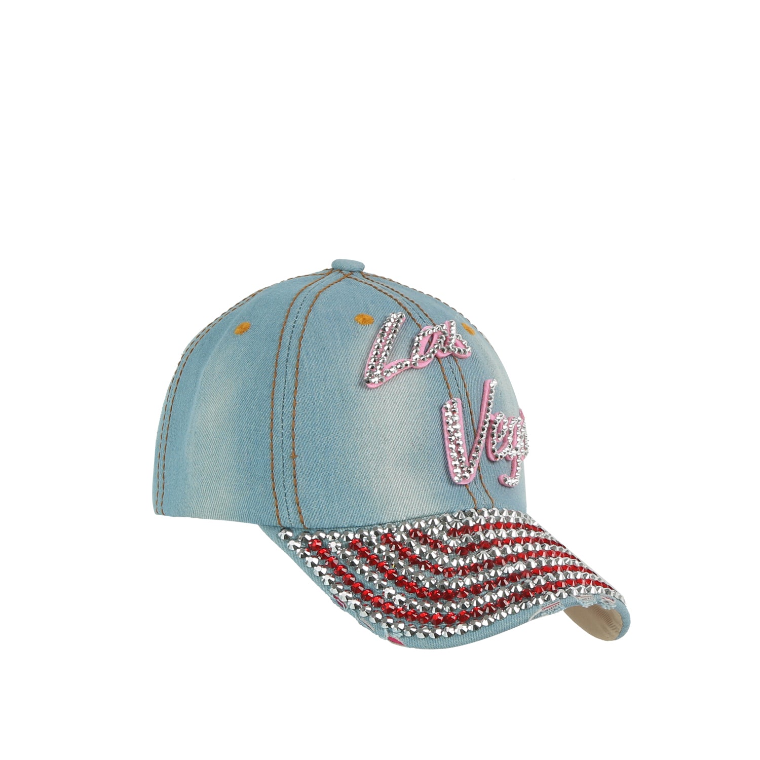 The Las Vegas Bling Cap is a light blue denim hat featuring Las Vegas in pink and white letters. Its brim sparkles with red, silver, and green striped sequins for a festive embroidered souvenir style.