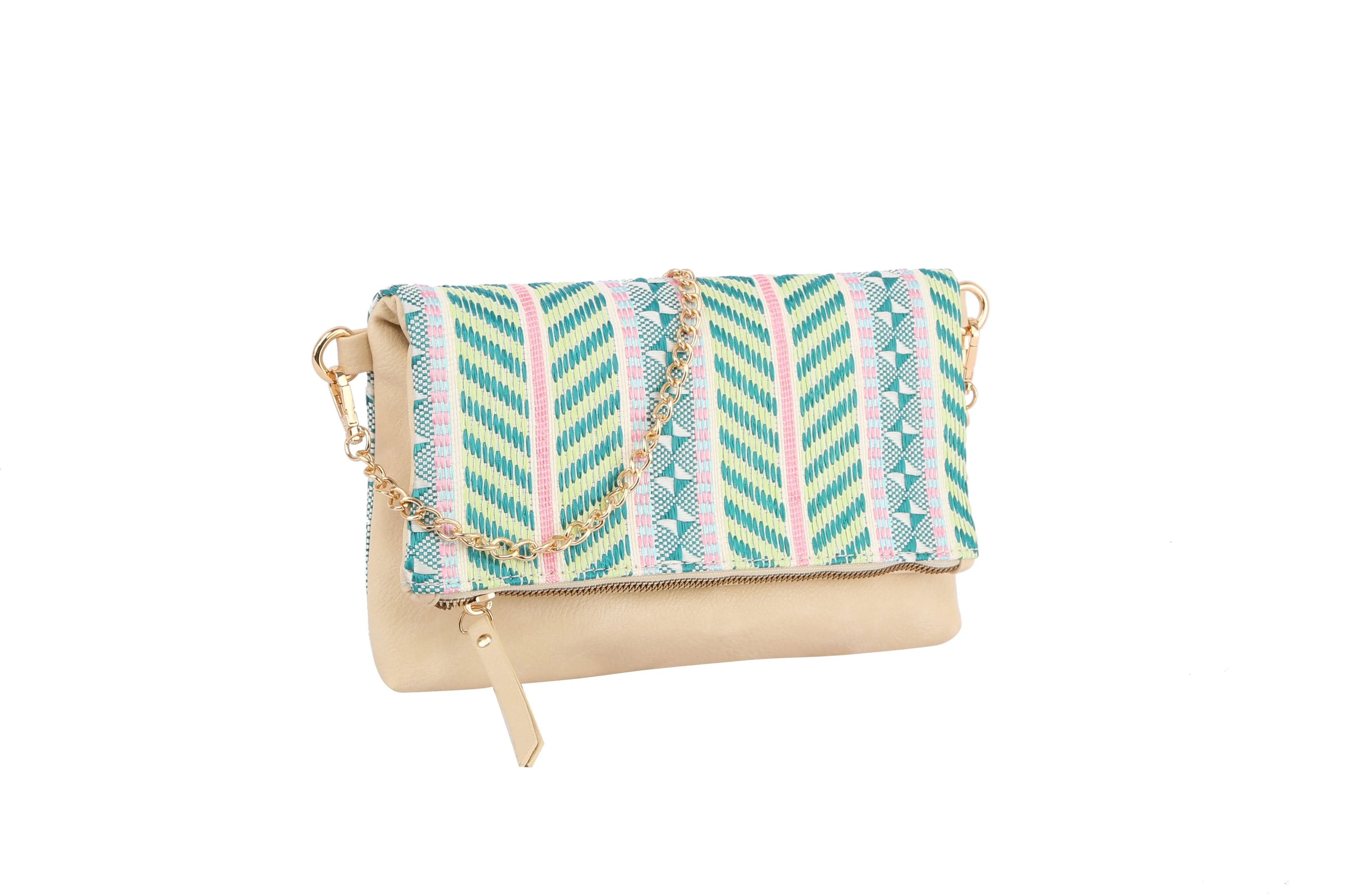 The Colorful Woven Crossbody Bag features a beige faux leather body, a teal, green, and pink geometric flap, a gold chain strap, and a rectangular gold charm.