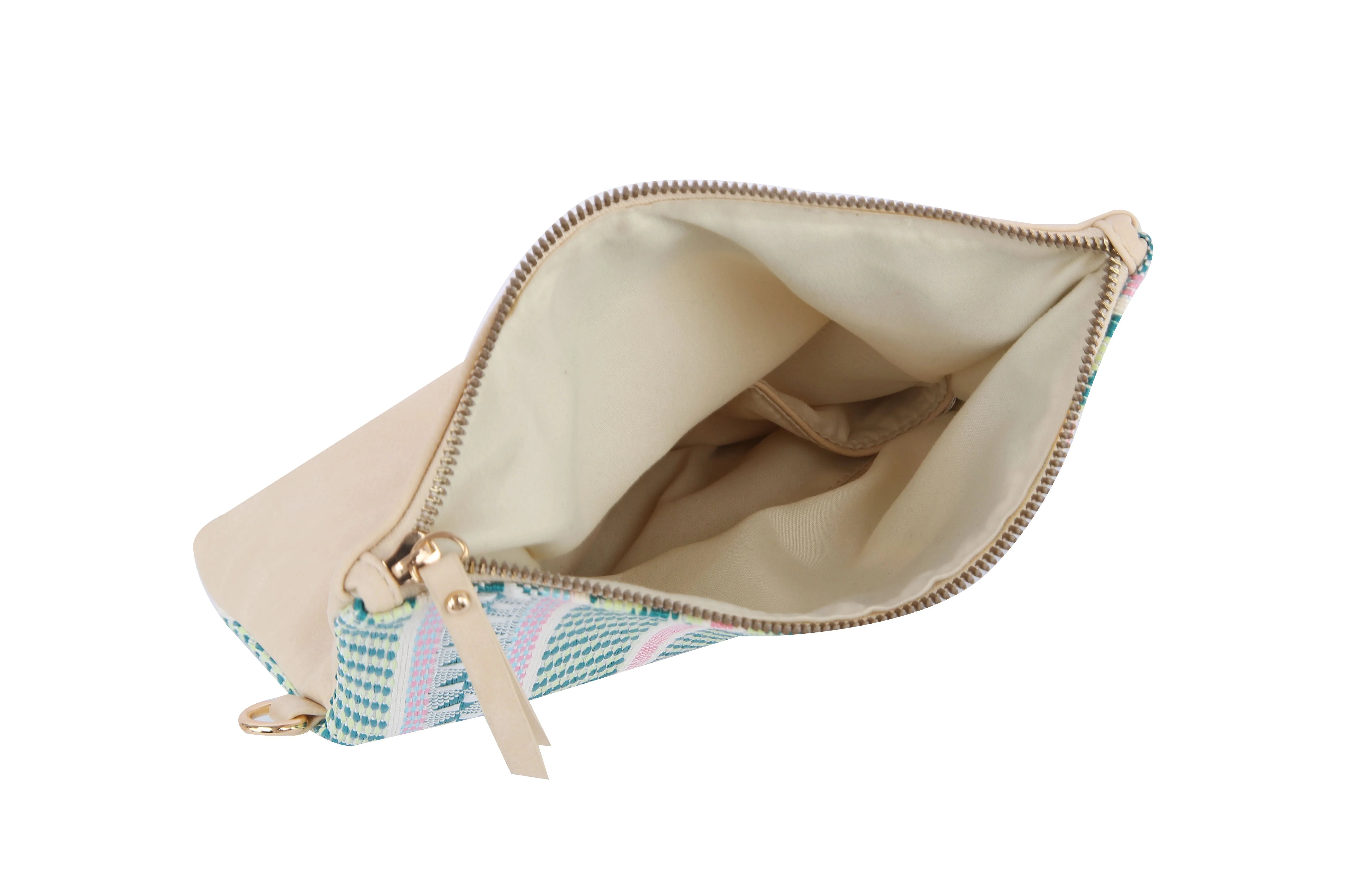 The Colorful Woven Crossbody Bag features a beige patterned faux leather exterior, gold-toned hardware, a zippered closure, cream fabric lining, and an inner pocket. Its shown open on a white background.