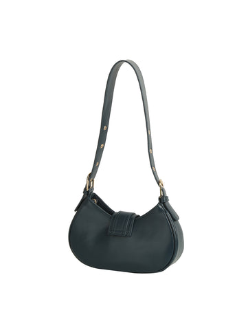 The Buckle Accented Petite Shoulder Bag is a small, dark green faux leather handbag featuring a curved bottom, adjustable strap, gold-toned hardware, and a front flap closure, shown against a white background.