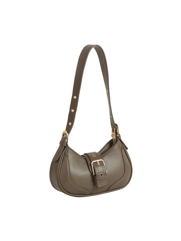 The Buckle Accented Petite Shoulder Bag features taupe faux leather, a curved shape, an adjustable studded strap, gold-tone hardware, and a large front buckle detail.