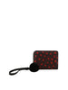 The Dainty Heart Print Petite Wristlet Wallet features black faux leather, card slots, a red heart pattern, a black wristlet strap, and a black fluffy pom-pom keychain, all displayed against a white background.