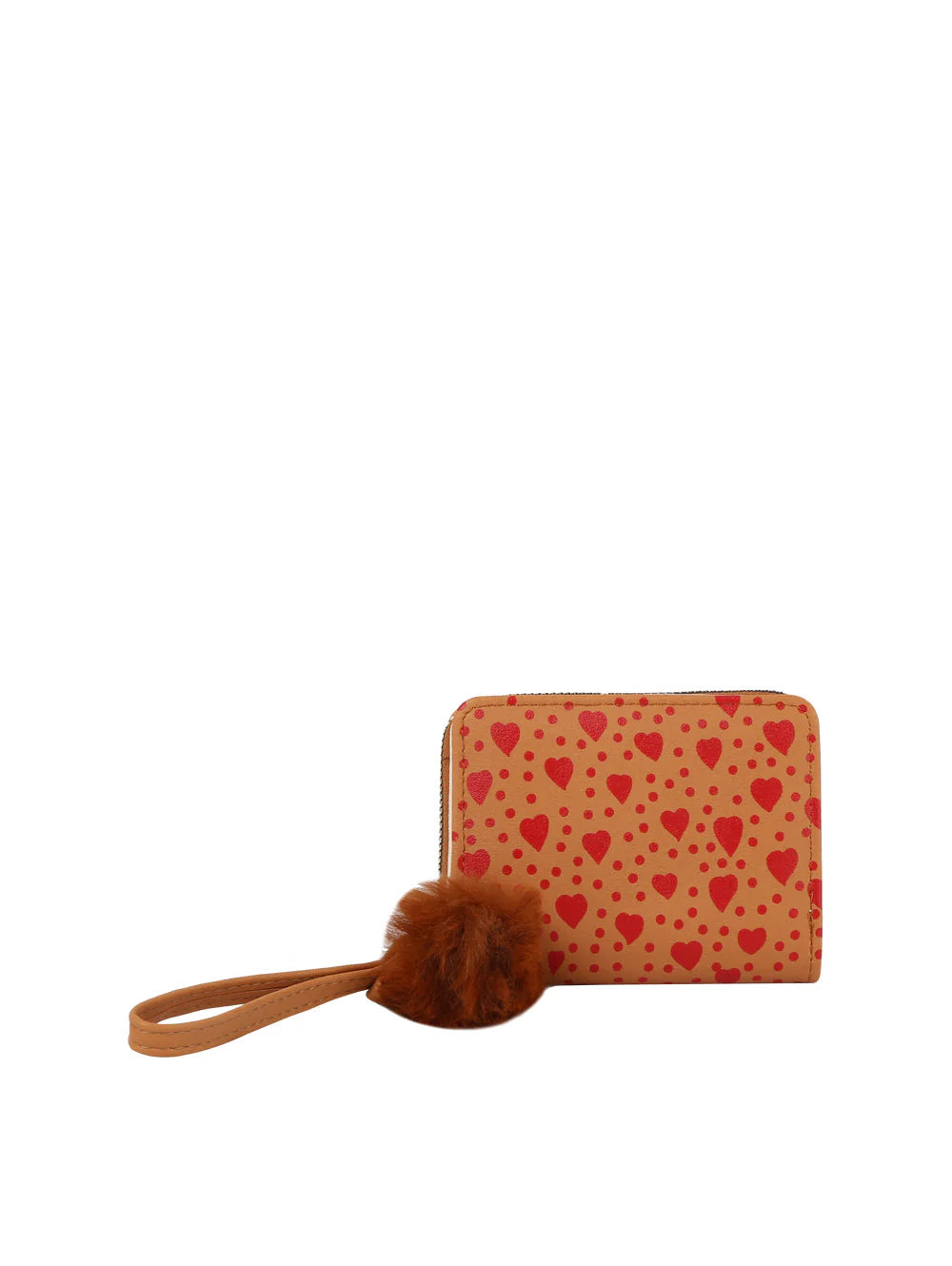 The Dainty Heart Print Petite Wristlet Wallet is a tan faux leather wallet with red heart prints, a brown wristlet strap, and a fluffy pom-pom keychain. Features zip closure and card slots for easy organization.