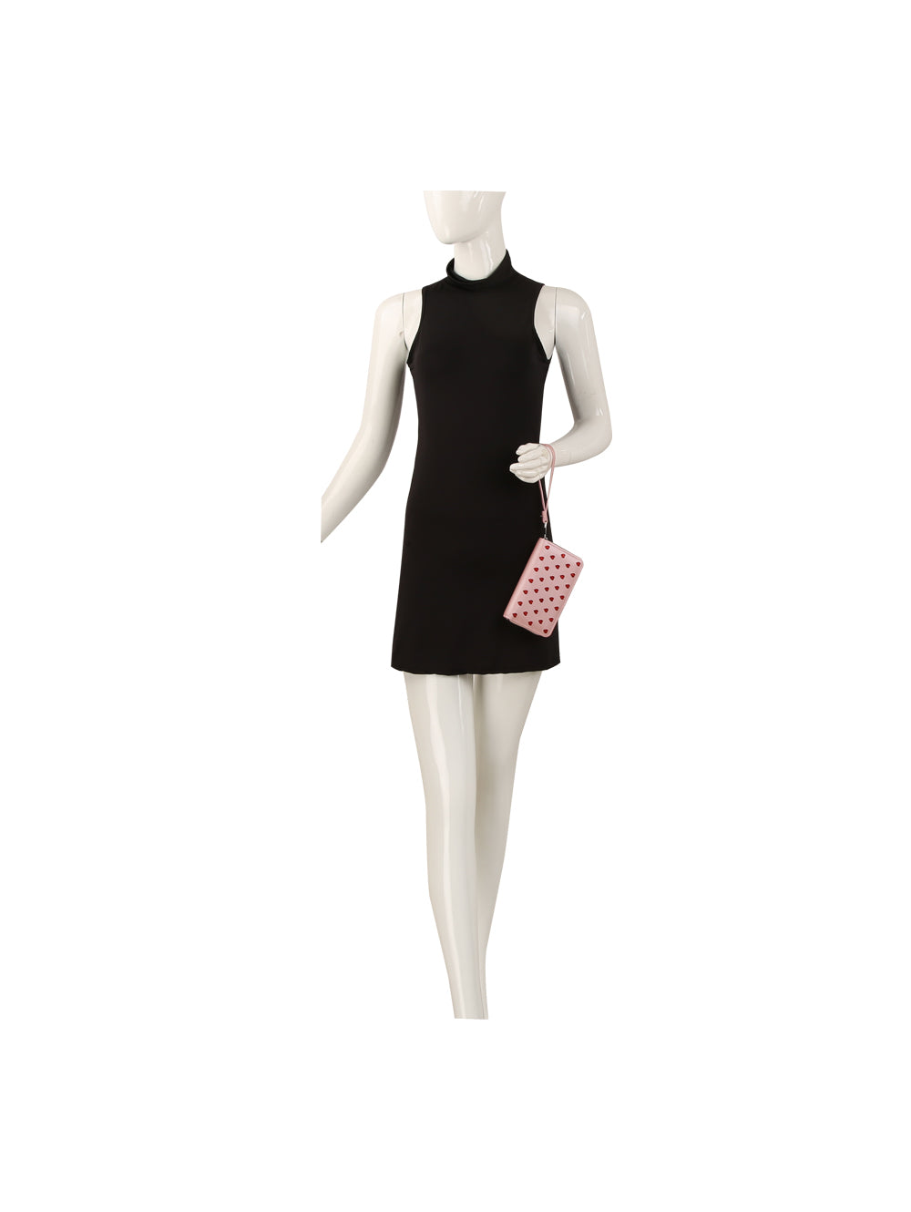 A mannequin in a sleeveless black high-neck mini dress holds a small Glitter Hearts Design Fashion Wallet, featuring pink faux leather, glitter heart pattern, and zip-around closure.