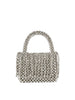 The Pearl Beaded Tassel Detailed Evening Clutch is a small handbag adorned with shiny silver beads, featuring a rounded beaded handle and detachable crossbody strap, displayed on a plain white background.