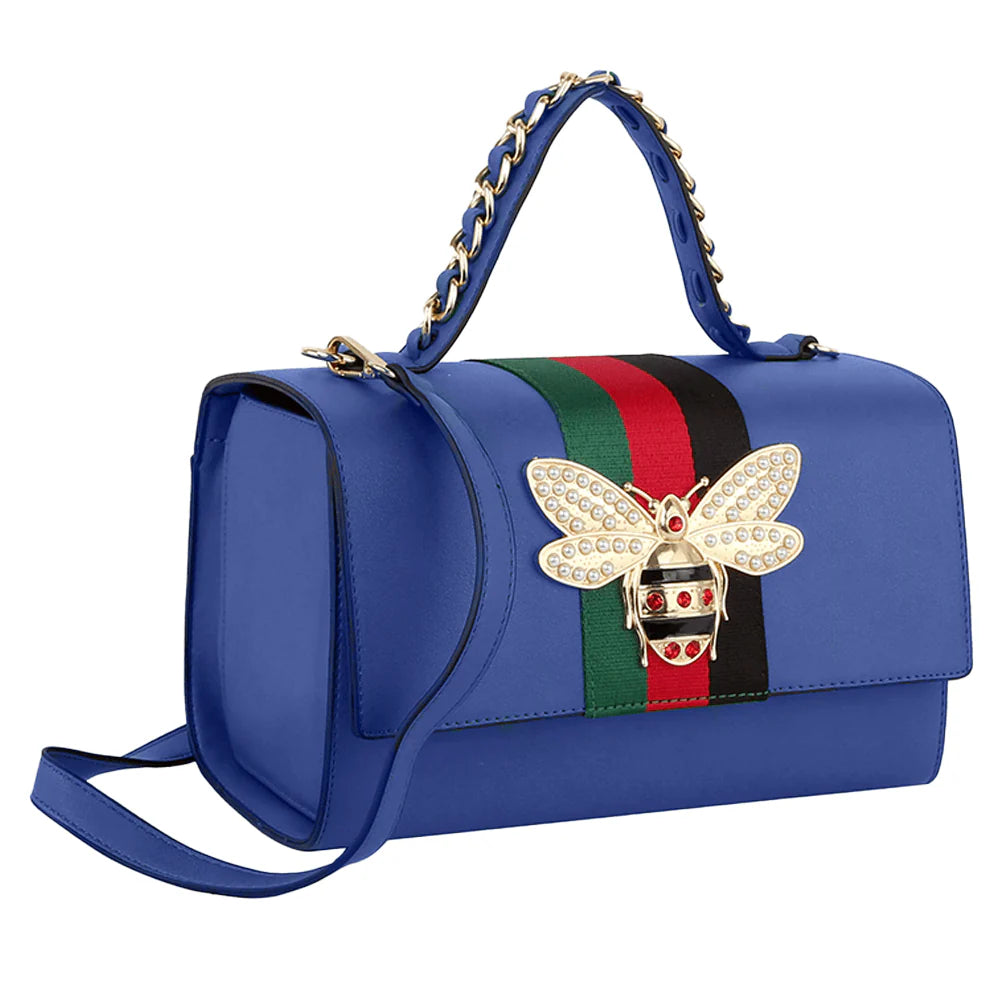 The Bee Pendant Patent Satchel Handbag Set features a blue faux leather bag with gold and pearl bee embellishment, green and red stripe, gold hardware, chain/leather handle, long strap, and an optional matching wallet.