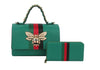 The Bee Pendant Patent Satchel Handbag Set features a green faux leather satchel with gold hardware, red and black stripes, and a jeweled bee pendant, paired with a matching wallet that has coordinating red and black stripes.
