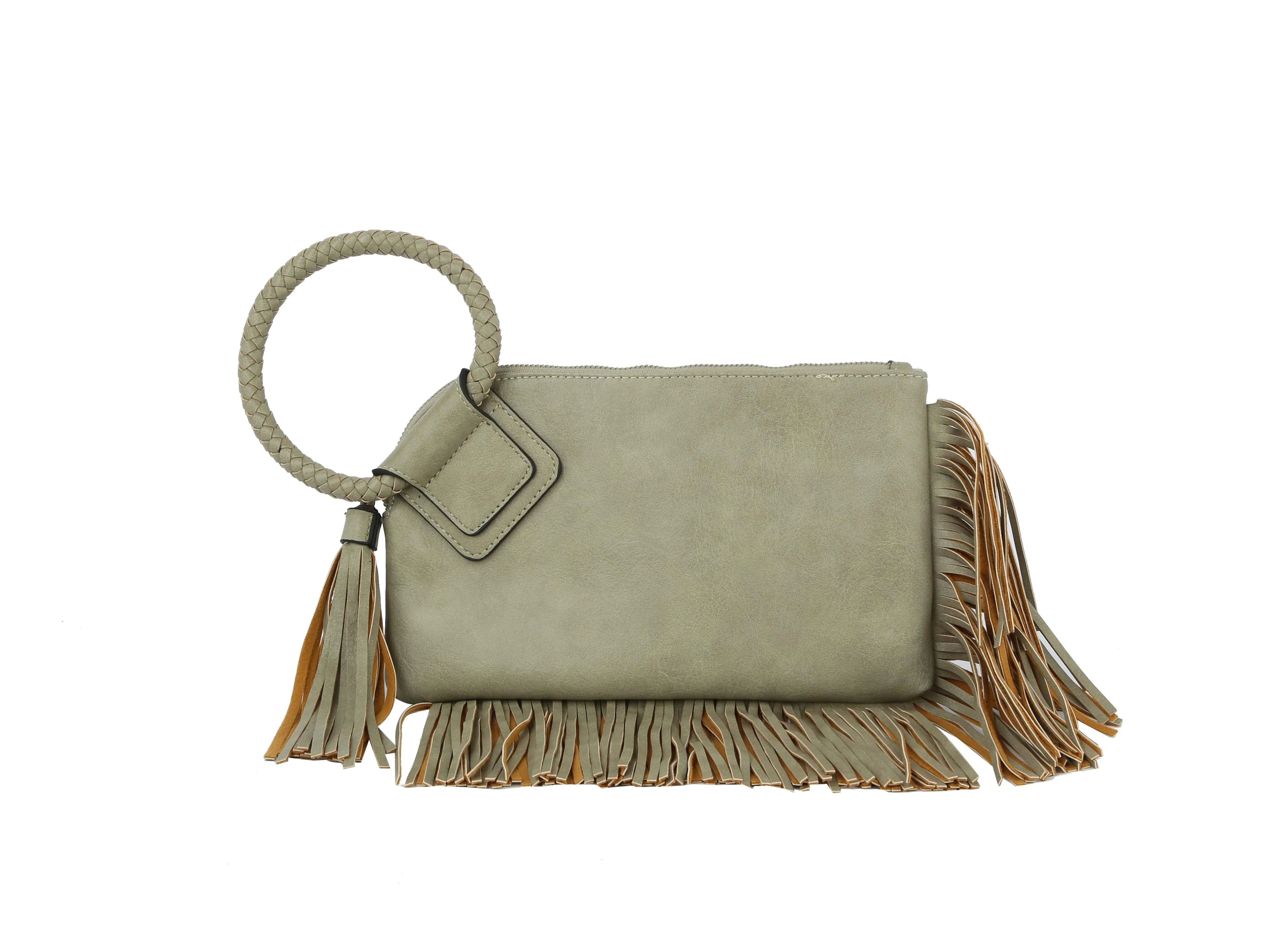 The Fringe Accented Wristlet Clutch Bag features light gray faux leather, a large braided circular handle, gold-toned hardware, and fringe detailing on the sides and bottom, shown against a white background.