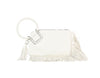 The Fringe Accented Wristlet Clutch Bag is a white faux leather handbag with a large braided circular handle, fringe details on the bottom and right side, decorative tassel, zip closure, and gold-tone hardware.