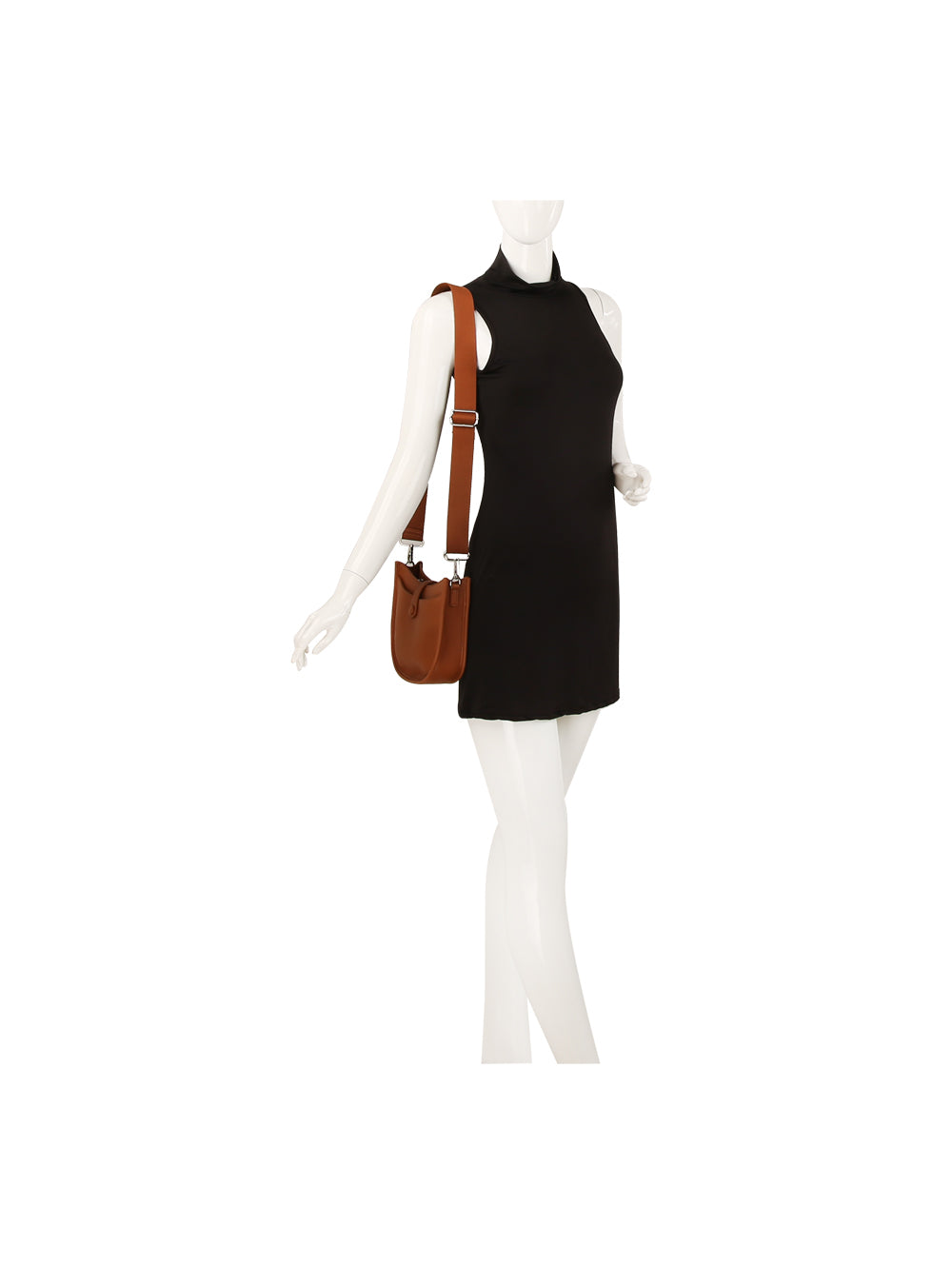 A mannequin wears a sleeveless black mini dress and carries the Chic Saddle Bag Design Shoulder Bag, a brown faux leather accessory with an adjustable strap.