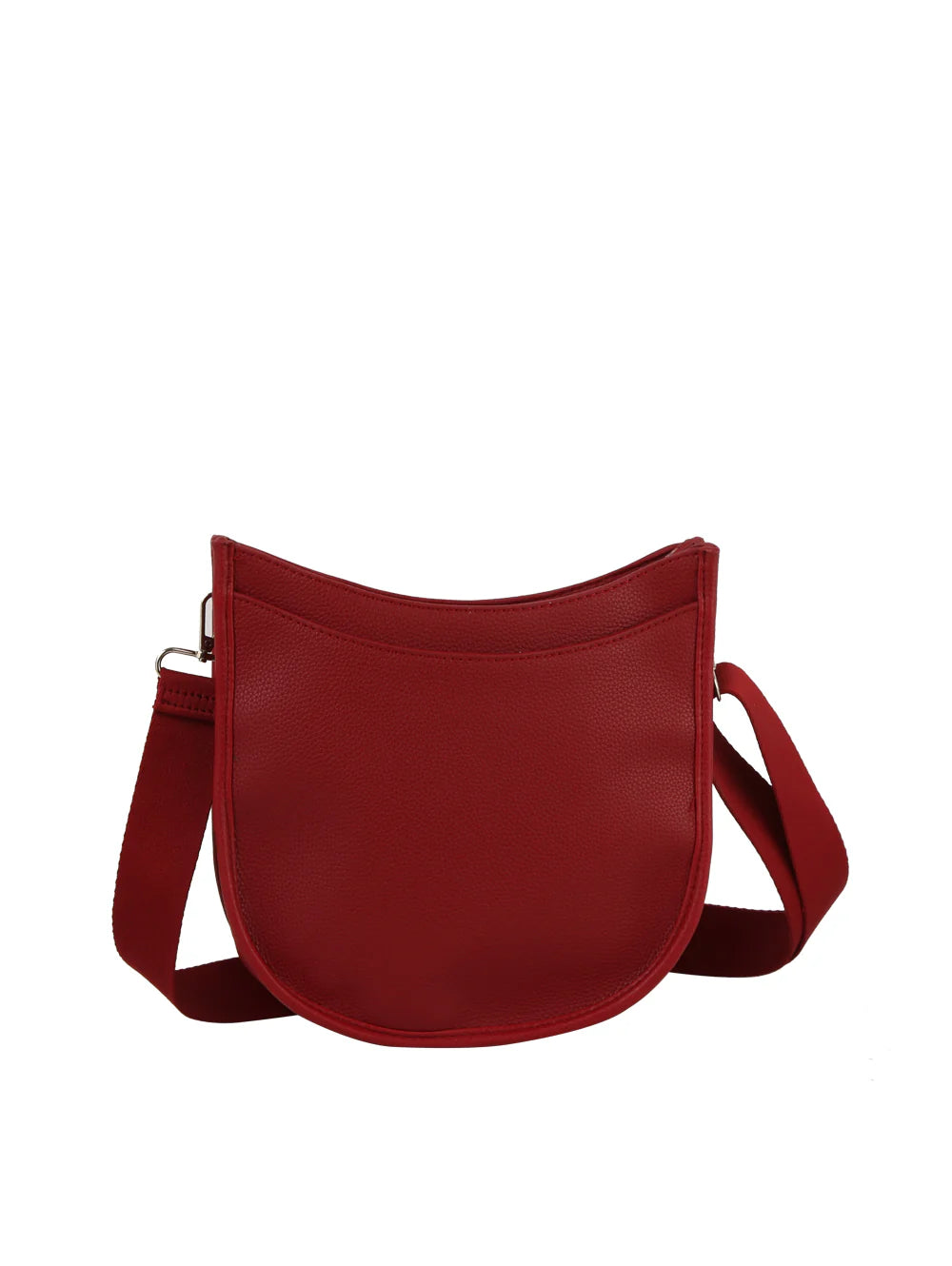 The Saddle Bag Inspired Curved Crossbody is a red faux leather bag with a crescent shape, wide adjustable strap, smooth minimalist finish, and top zip closure, shown against a plain white background.