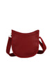 The Saddle Bag Inspired Curved Crossbody is a red faux leather bag with a crescent shape, wide adjustable strap, smooth minimalist finish, and top zip closure, shown against a plain white background.
