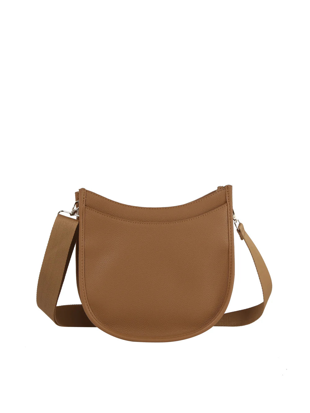 The Saddle Bag Inspired Curved Crossbody is a tan faux leather bag with a curved top, wide adjustable strap, minimal design, and a top zip closure, shown against a plain white background.