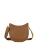 The Saddle Bag Inspired Curved Crossbody is a tan faux leather bag with a curved top, wide adjustable strap, minimal design, and a top zip closure, shown against a plain white background.
