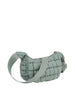 The Quilted Puffer Crossbody Hobo is a light sage green, quilted nylon bag featuring an adjustable single strap and top zip closure, shown against a white background.