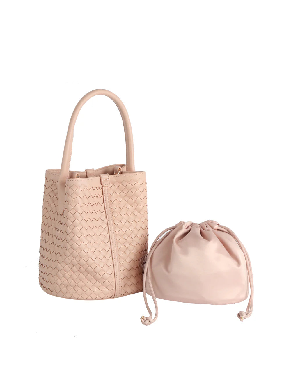 The Woven Bucket Bag Two Piece Set features a light pink faux leather bucket bag with round handles and gold-toned hardware, shown beside a matching drawstring pouch against a white background.