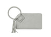The Braided Handle Wristlet Clutch is a light gray purse with a circular braided handle, matching tassel, zip closure, minimalist design, and convenient interior credit card slots.