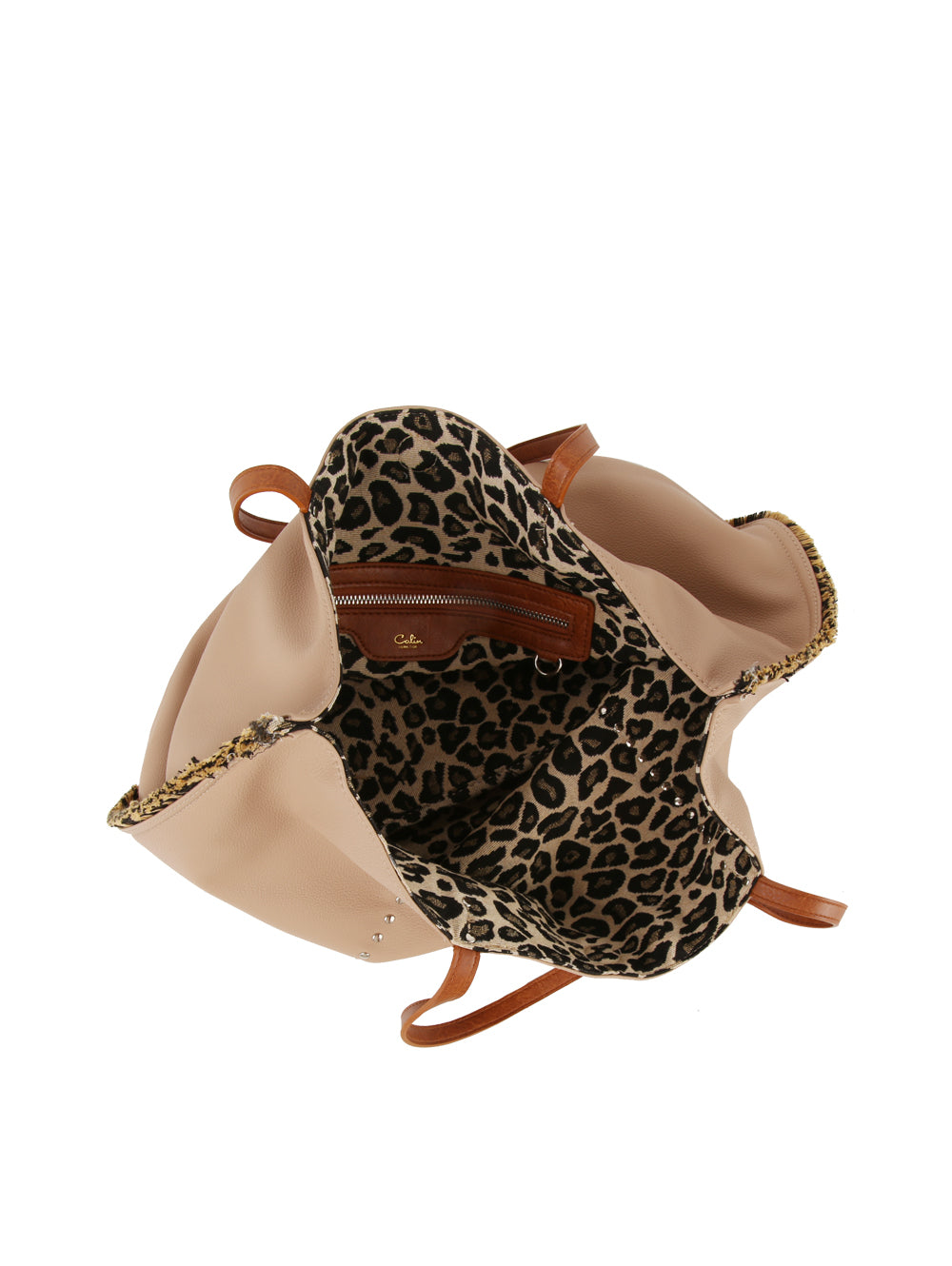 The Leopard Trim Slouch Tote Handbag is an open beige tote with brown handles, a roomy interior lined with reversible leopard print fabric, and a zippered inner pocket—an elegant everyday faux leather bag.