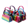 Six small Colorful Rainbow Lipstick Case Assorted, each with a unique colored handle, are arranged in two rows on a white background. These faux leather cases feature clasp closures and vibrant rainbow-gradient patterns.