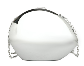 The Modern Patent Shoulder Bag is a small, shiny silver clutch with a curved geometric shape and delicate chain strap—a modern accessory that adds elegance to any outfit.