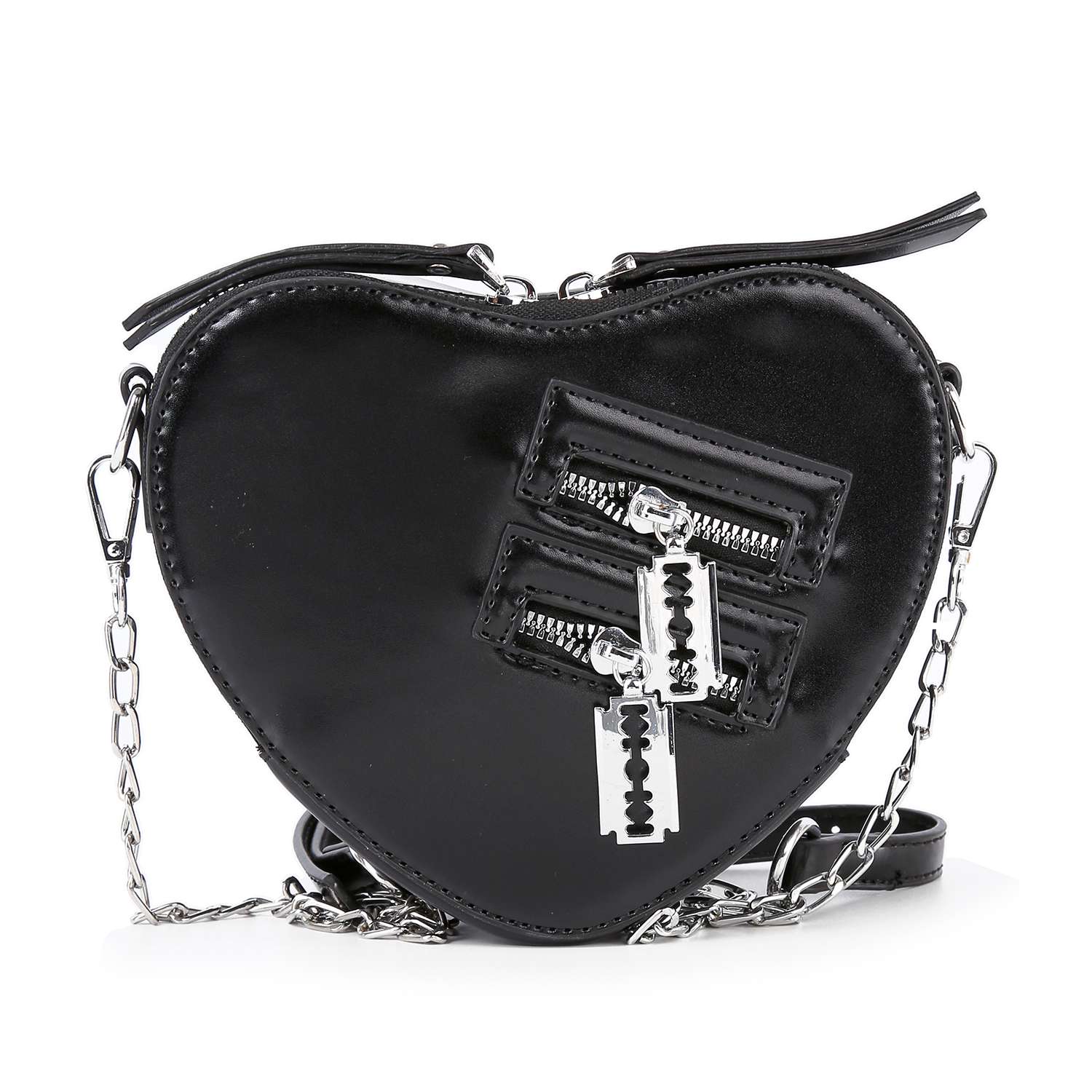 The Modern Heart Petite Shoulder Bag is a black, heart-shaped faux leather purse with a glossy finish, featuring silver chain straps, two zippered pockets with razor blade-shaped pulls for an edgy, punk-inspired look.
