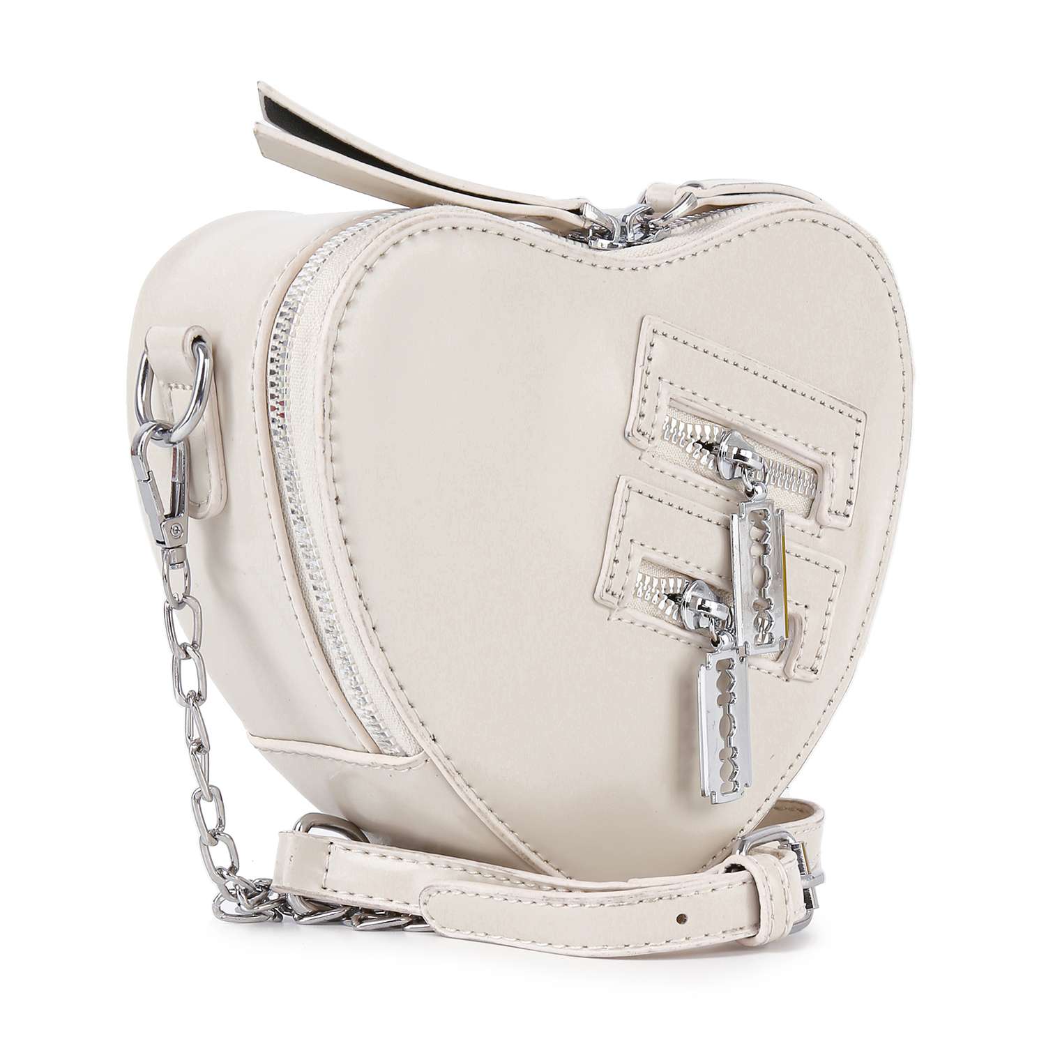 The Modern Heart Petite Shoulder Bag is a cream, heart-shaped faux leather purse with silver hardware, a chain strap, two front diagonal zippers, and a chic smooth texture.