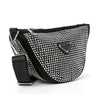The Sparkling Rhinestone Crossbody Sling is a black gemstone-inspired bag adorned with small, shiny rhinestones, featuring a wide adjustable strap and a front silver triangular logo plate.