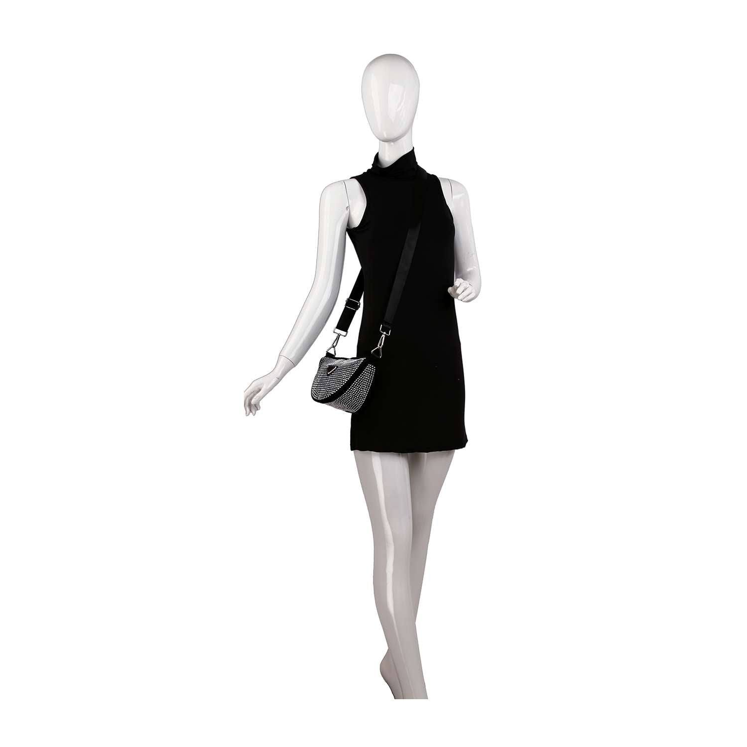 A white mannequin models a sleeveless black mini dress and the Sparkling Rhinestone Crossbody Sling, a small faux leather bag with an adjustable strap, posed against a white background.