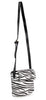 The Classic Front Flap Cell Phone Crossbody Bag features a long adjustable black strap, gold-toned hardware, and a bold black-and-white zebra print pattern on the body.