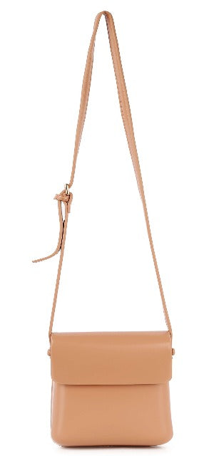 The Classic Front Flap Cell Phone Crossbody Bag is a tan leather petite bag with a long adjustable strap, flap closure, and minimalist design. Featuring gold-toned hardware, this compact, structured bag is smooth and ideal for daily use.