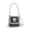 The Pearl And Rhinestone Accented Ultra Petite Evening Bag is a small black faux leather clutch featuring rhinestones, a heart-shaped front gem, and an elegant pearl beaded handle.