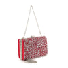 The Dazzling Cluster Stone Accented Evening Bag is a small rectangular red faux leather clutch with white and silver glittery sequins, a metal top clasp, and a detachable silver chain strap.