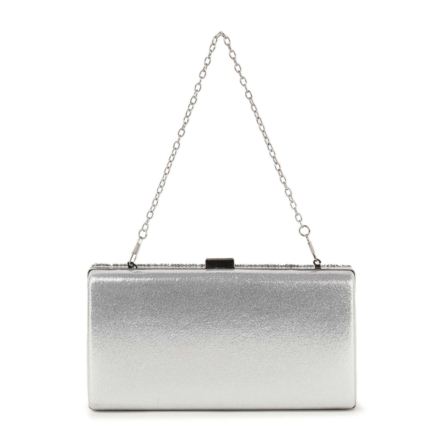 The Dazzling Cluster Stone Accented Evening Bag is a rectangular silver clutch purse with a metallic finish, a delicate chain strap, and clasp closure on top. Crafted from faux leather, it is shown against a white background.