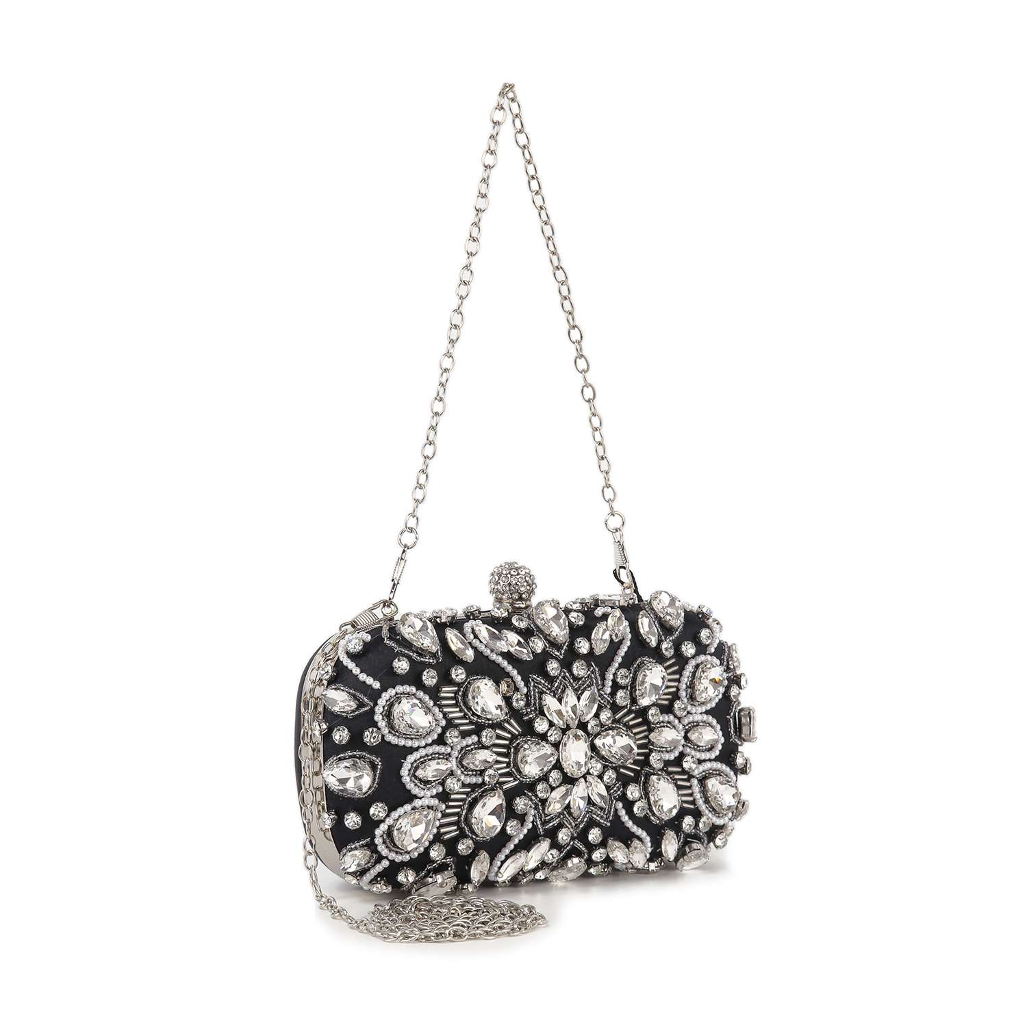 The Highly Decorative Retro Evening Bag is a small black evening bag with a silver chain handle, featuring large, ornate silver and clear crystal embellishments in elegant floral and leaf designs.
