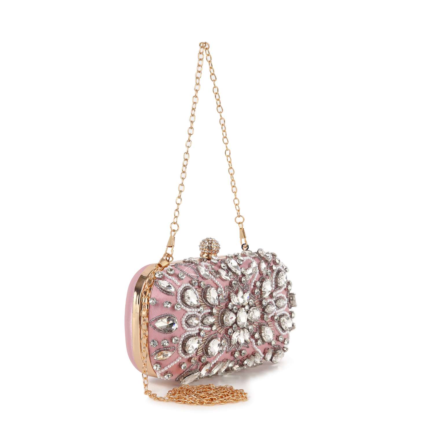 The Highly Decorative Retro Evening Bag is a small pink evening bag with a gold chain handle, adorned on the front with ornate silver and clear crystal floral embellishments.