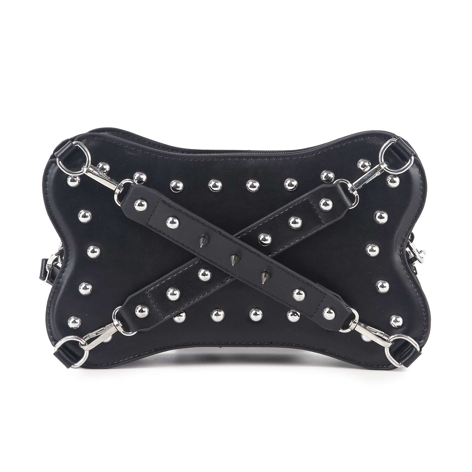 The Studded Belted Shoulder Bag is a black faux leather handbag with a bone-shaped design, silver studs, and two crisscrossing straps adorned with metal spikes.