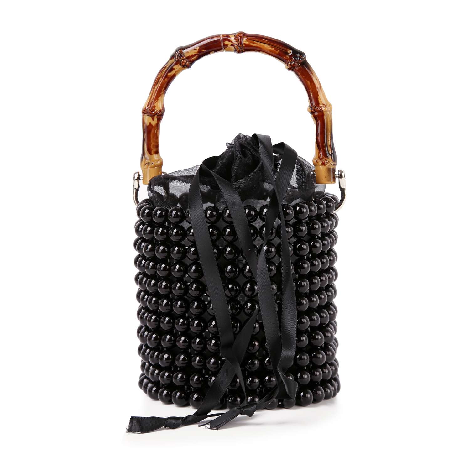 The Beaded Unique Evening Bag is a petite bucket bag with a cylindrical shape, shiny black beads, bamboo-style handle, black ribbon ties at the top, and delicate black mesh accents.