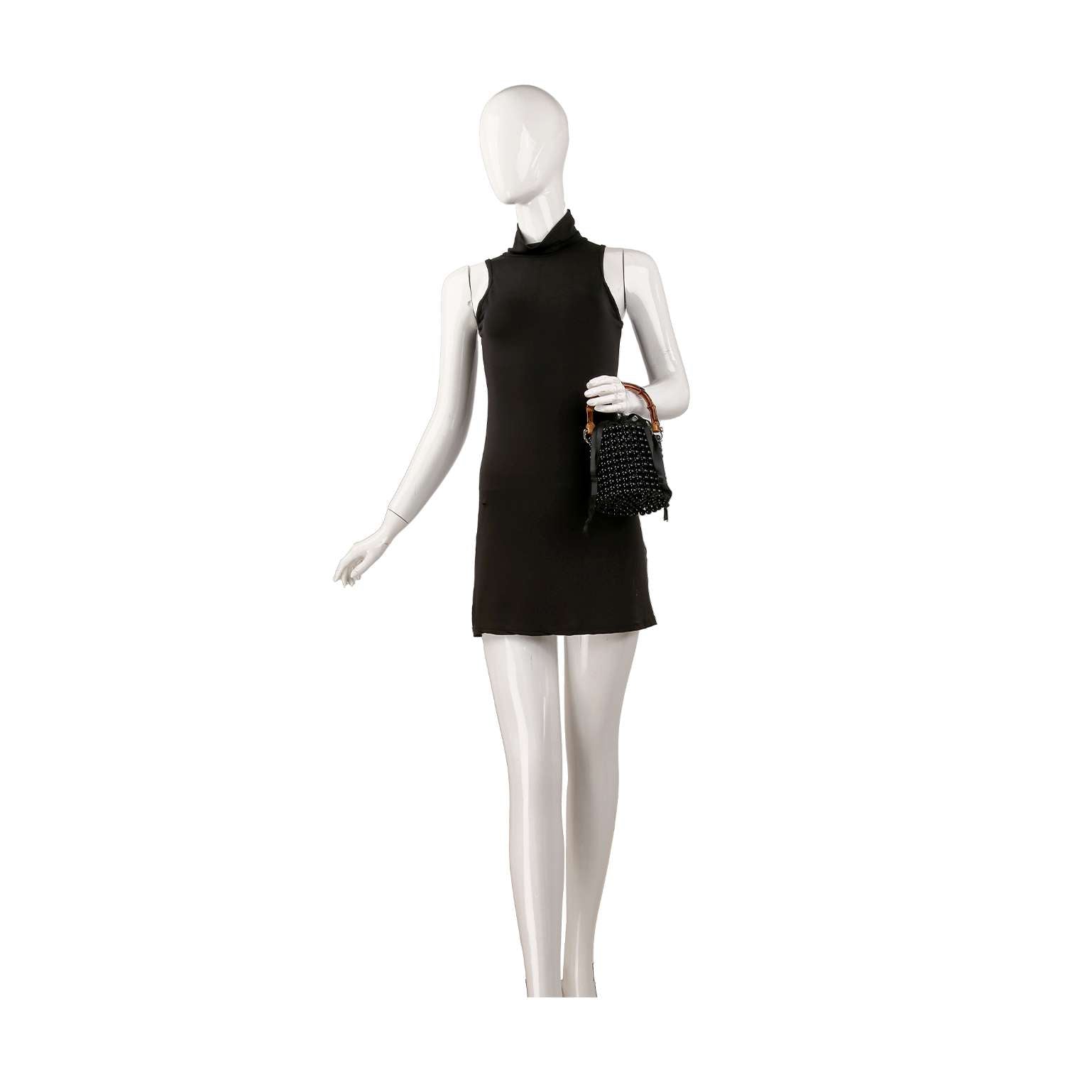 A mannequin in a sleeveless black mini dress holds the Beaded Unique Evening Bag, featuring a petite bucket shape and drawstring closure, posed against a plain white background.