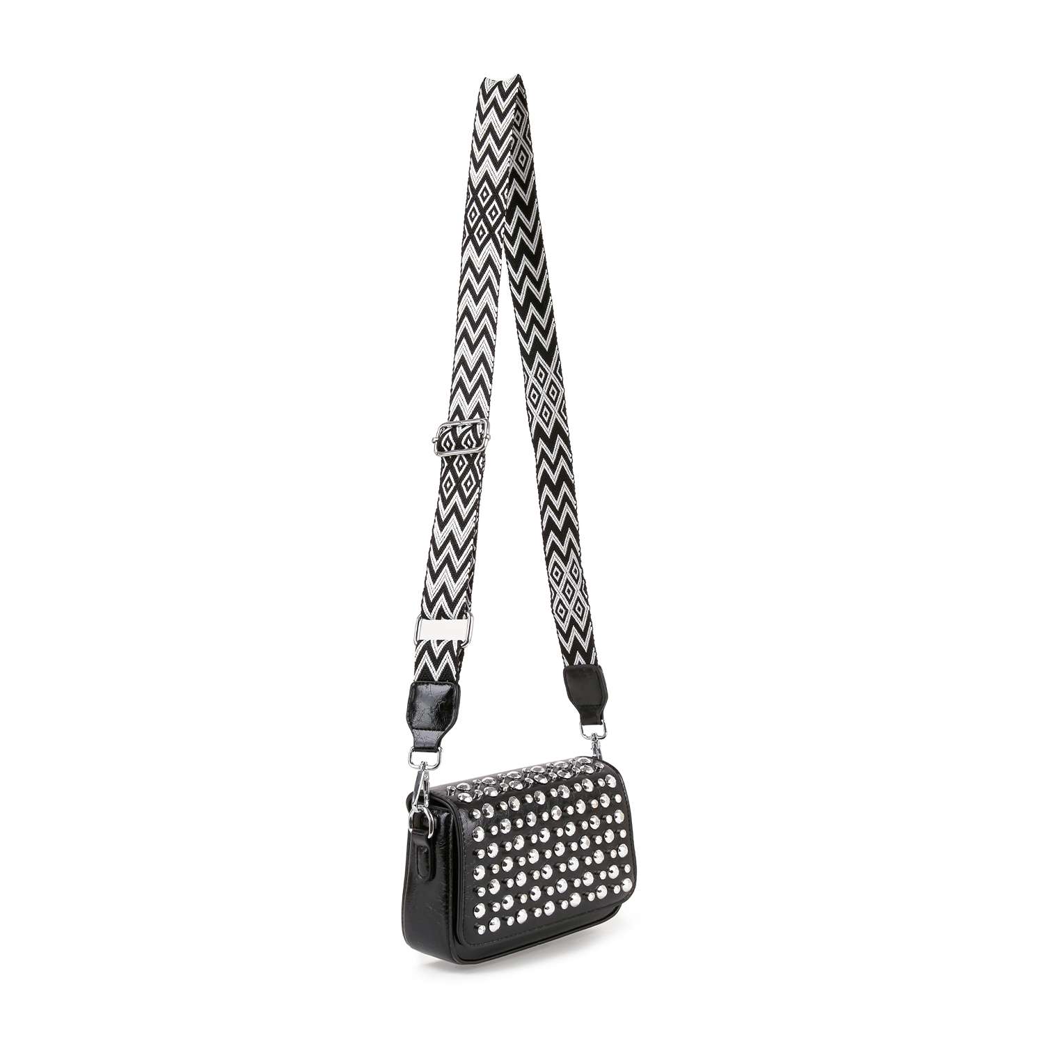 The Guitar Strap Accented Studded Shoulder Bag is a small black faux leather shoulder bag featuring silver studs on the front and a wide, adjustable black-and-white zigzag strap. Displayed against a plain white background.