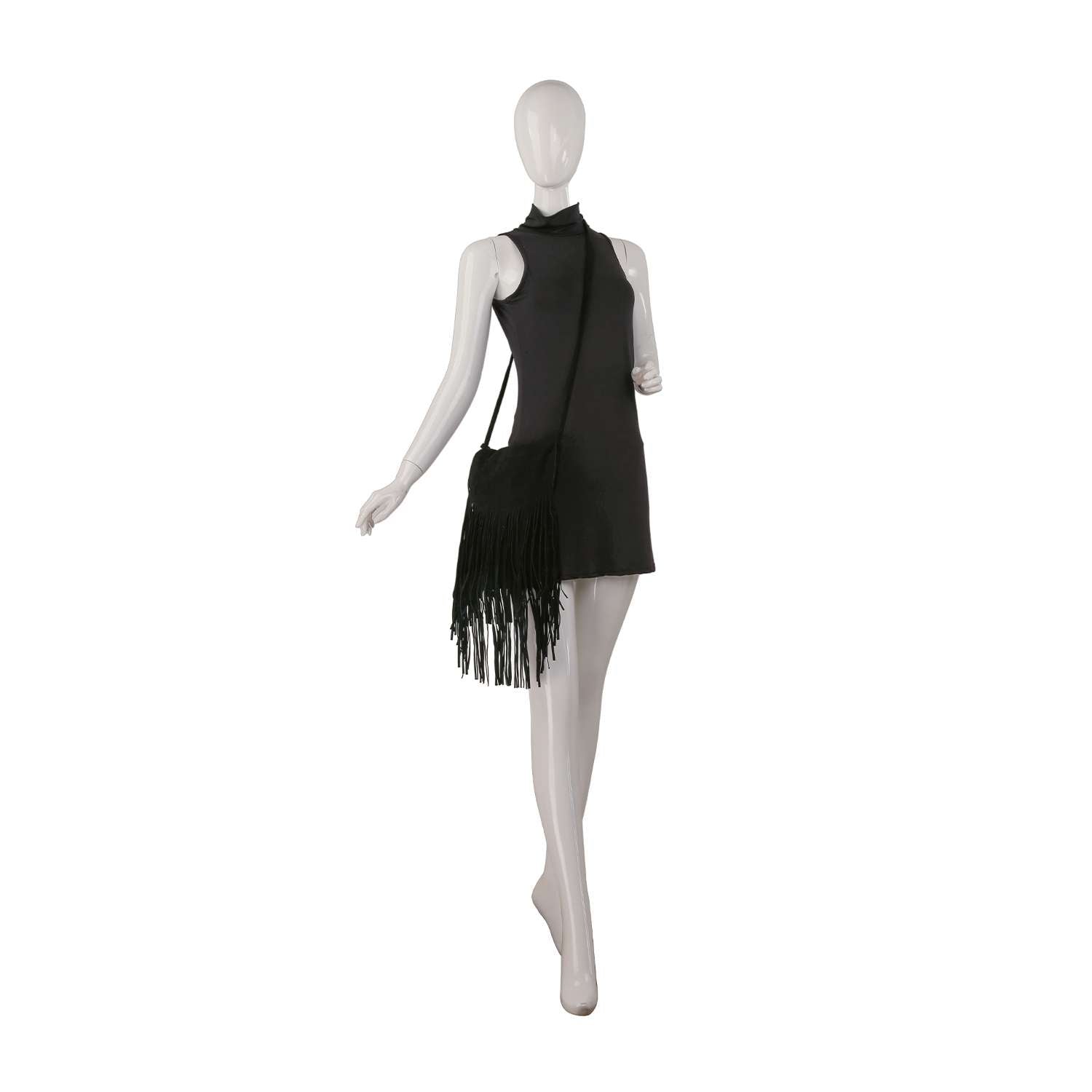 A mannequin in a sleeveless black mini dress carries the Long Fringe Shoulder Bag, posed as if walking with one arm slightly bent and the other hanging naturally.