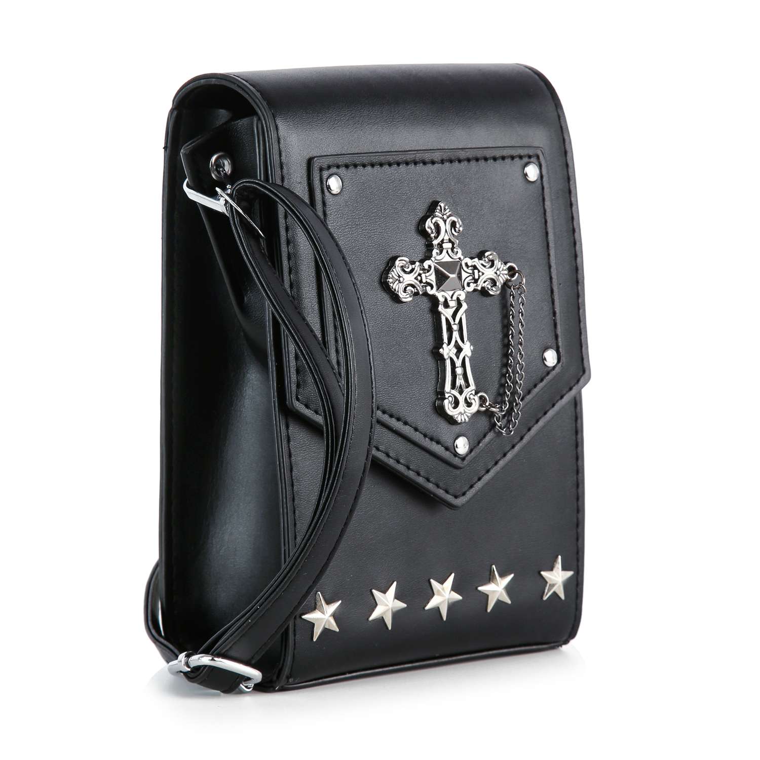 The Decorative Cross Accented Petite Crossbody Bag is a black faux leather bag with a silver cross medallion on the flap, a small chain, five star studs along the bottom edge, and a long shoulder strap.