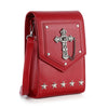 The Decorative Cross Accented Petite Crossbody Bag is a small red faux leather bag with a silver cross medallion, chain, four star studs on the bottom edge, and a matching red strap.