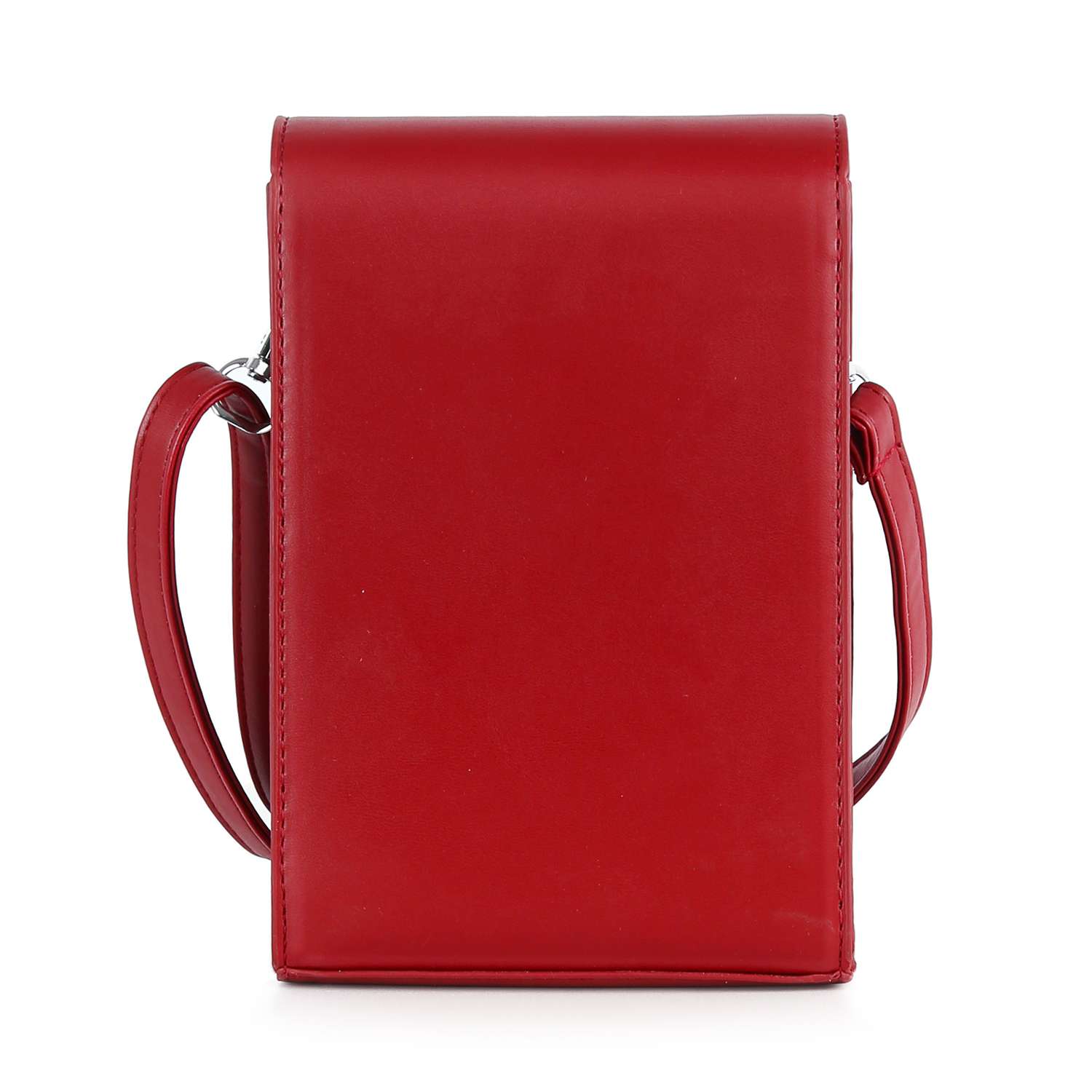 The Decorative Cross Accented Petite Crossbody Bag is a rectangular red faux leather bag with a smooth, minimalist design and a long strap, shown standing upright against a white background.