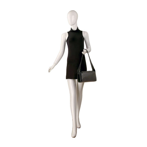 A mannequin wears a sleeveless black mini dress and carries the Super Studded Hobo Handbag, a faux leather shoulder bag with silver studs, posed against a white background.