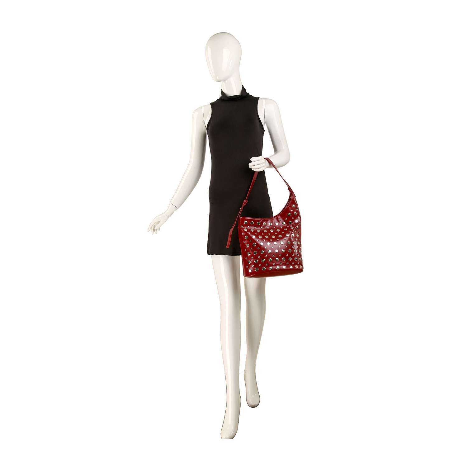 A mannequin in a sleeveless black dress holds the Patent Unique Hobo Design Handbag, a large purse with white polka dots, standing against a plain white background.
