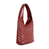 The Super Studded Hobo Handbag is a red faux leather shoulder bag with one strap, decorated with rows of silver round studs, displayed upright on a white background.