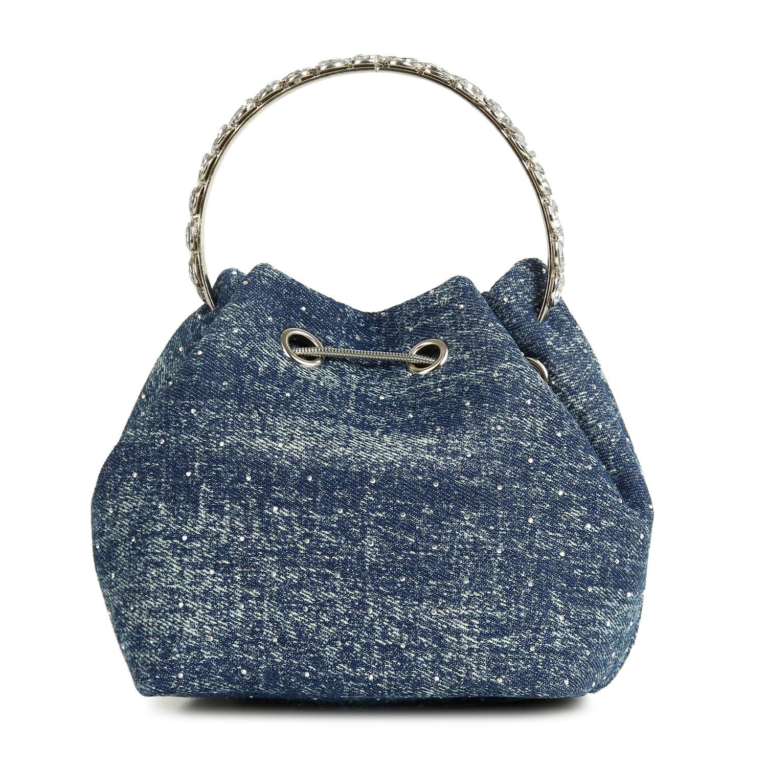 The Denim Tiny Stone Accented Drawstring Bag is a blue denim crossbody purse with textured fabric, eyelet details at the top, a metallic round handle, and stylish versatility for everyday wear.
